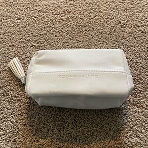 Rodan and Fields cosmetics case. Leather bottom, cloth top. Waterproof interior